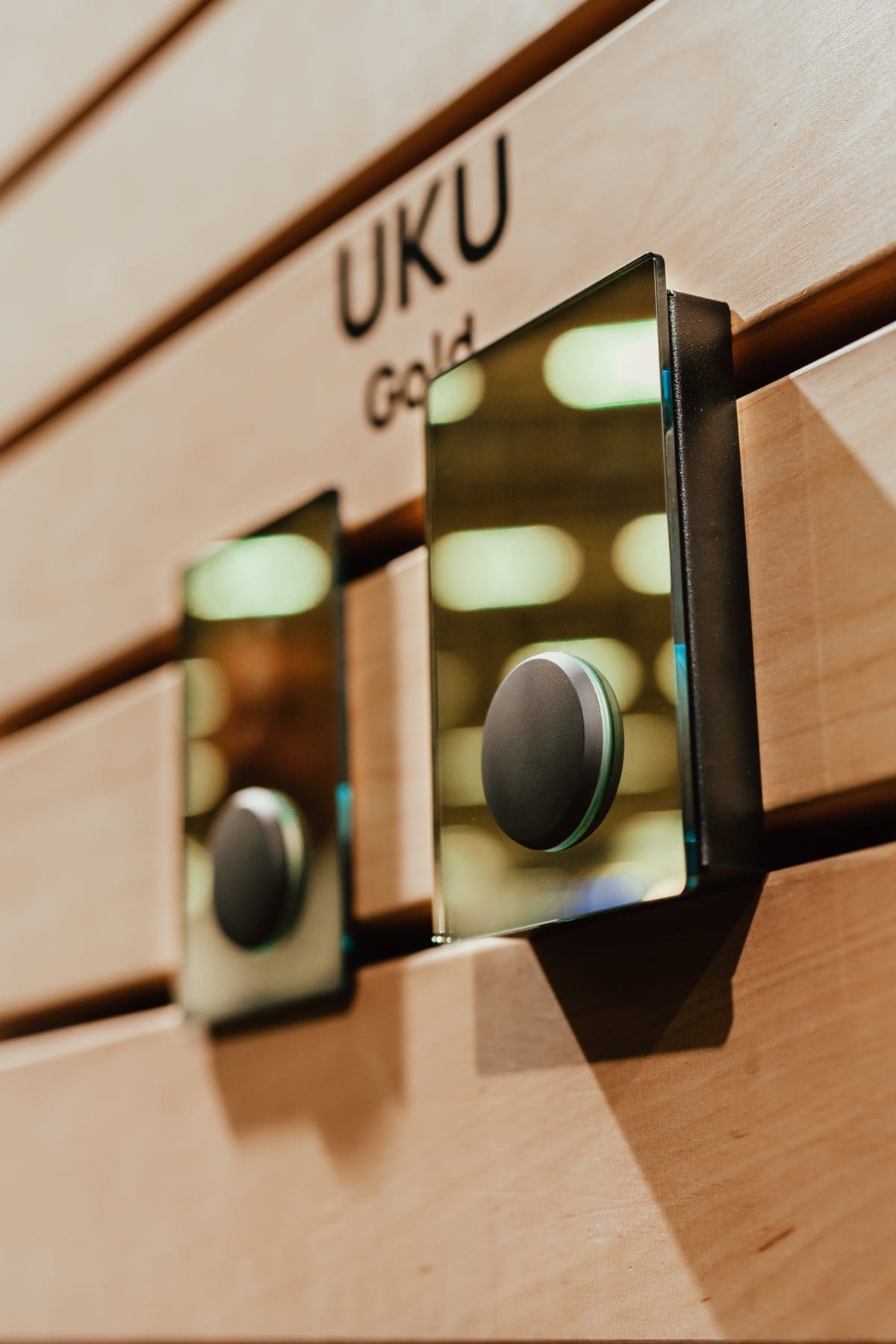 Two More High End Huum Uku Sauna Thermostat And Environment Controllers On Display At A Trade Show.