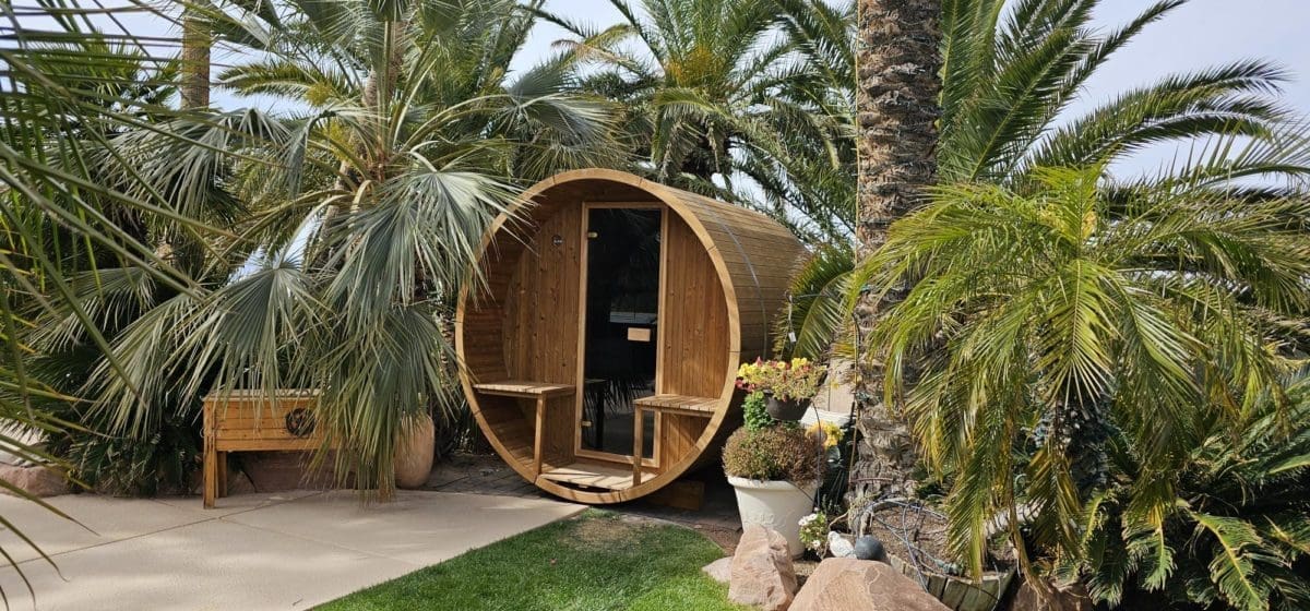 Enjoy a luxurious sauna experience in the comfort of your backyard with the Thermory Barrel Sauna Kit for sale in Nevada, surrounded by palm trees. Highly recommended by a satisfied customer on Sauna Marketplace."