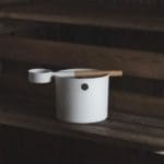 White sauna bucket and ladle on the bench