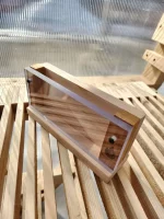Artistic image of the sauna phone case placed elegantly on a sauna bench, capturing its natural beauty