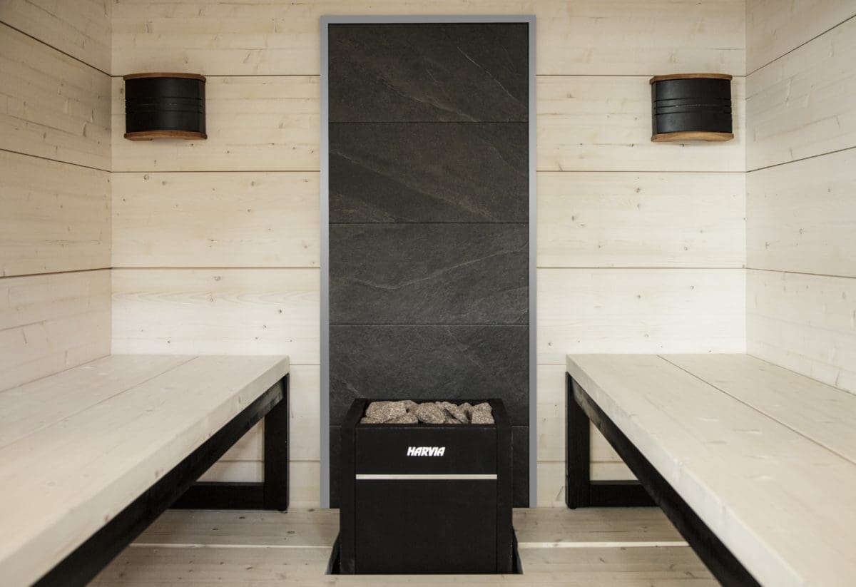 harvia virta with stone wall in modern finnish sauna