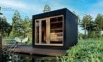 Alt Tag: "SaunaLife Garden-Series Model G7 outdoor home sauna showcasing its Thermo-Pine exterior cladding and clear tempered glass front wall."