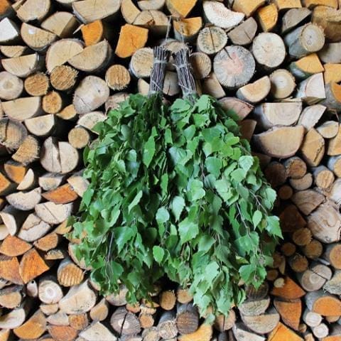 birch sauna whisk surrounded by wood