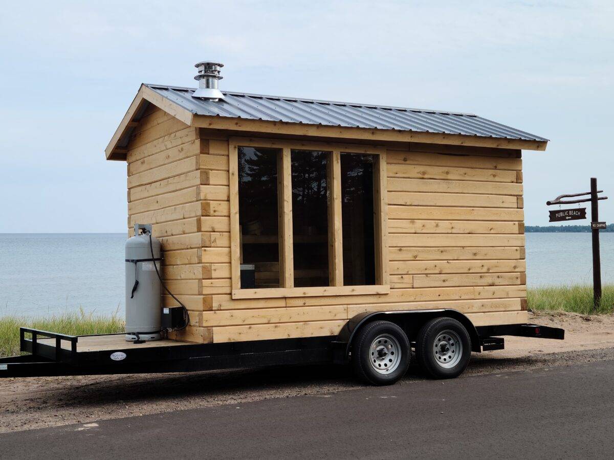 Propane in front of mobile sauna on lake michigan