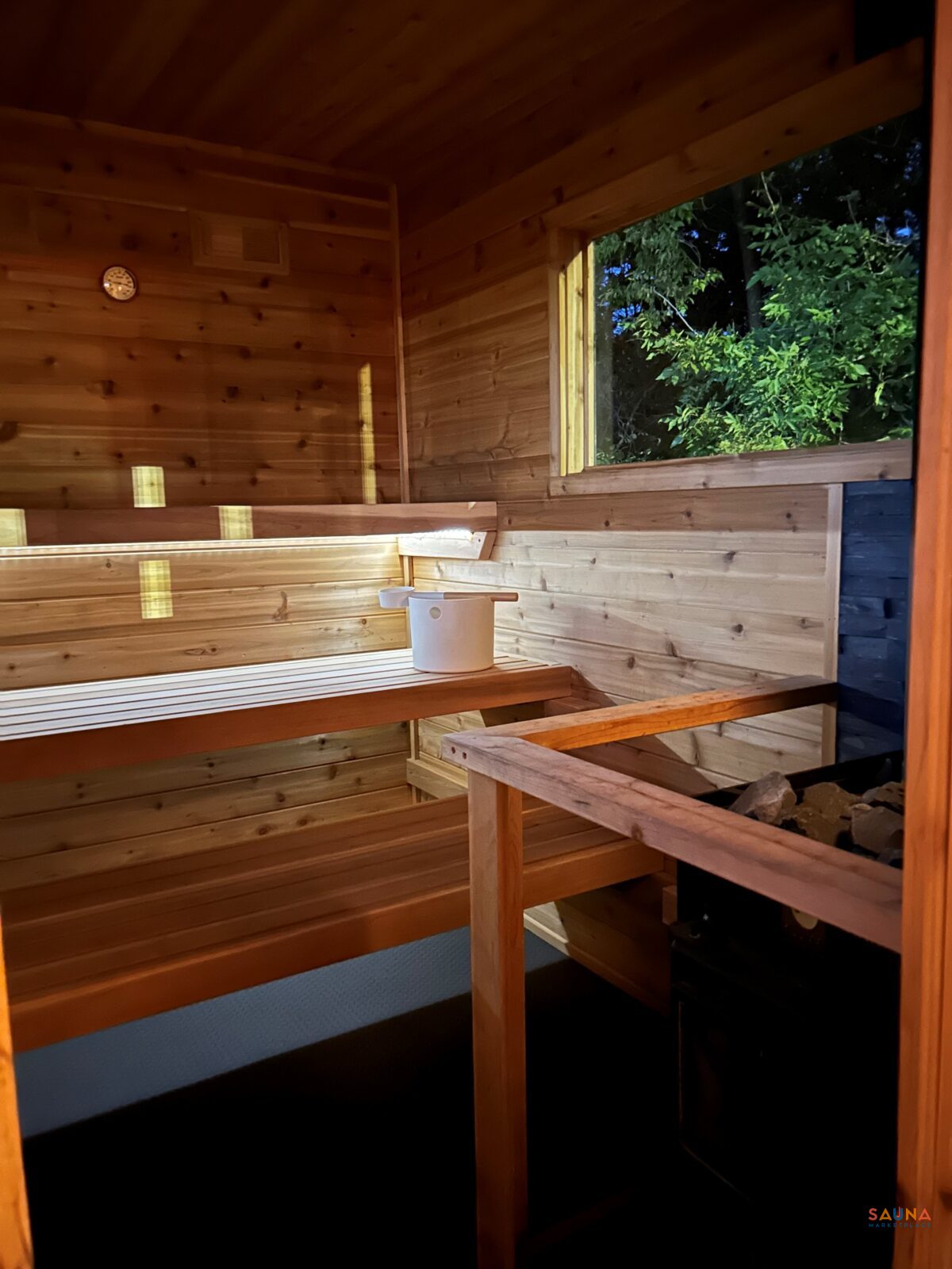 Sauna Room With Window And Wood Fired Stove