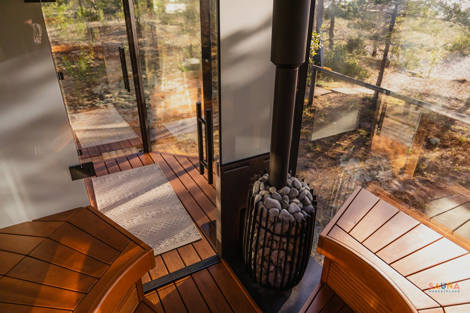 Cozy Wood Stove Inside The Changing Room Of The Mirrored Glass Haljas Hele Double Prebuilt Sauna From Estonia